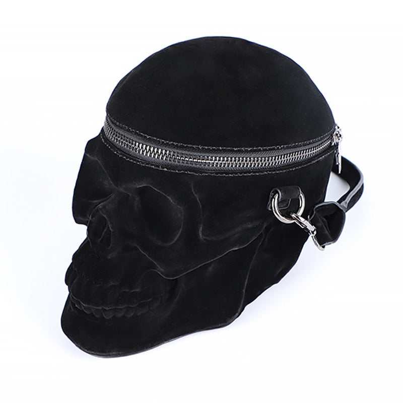 Blackthorn 31 Gothic velvet skull purse featuring 3D design, black zipper, shoulder strap, and motorcycle-inspired style.