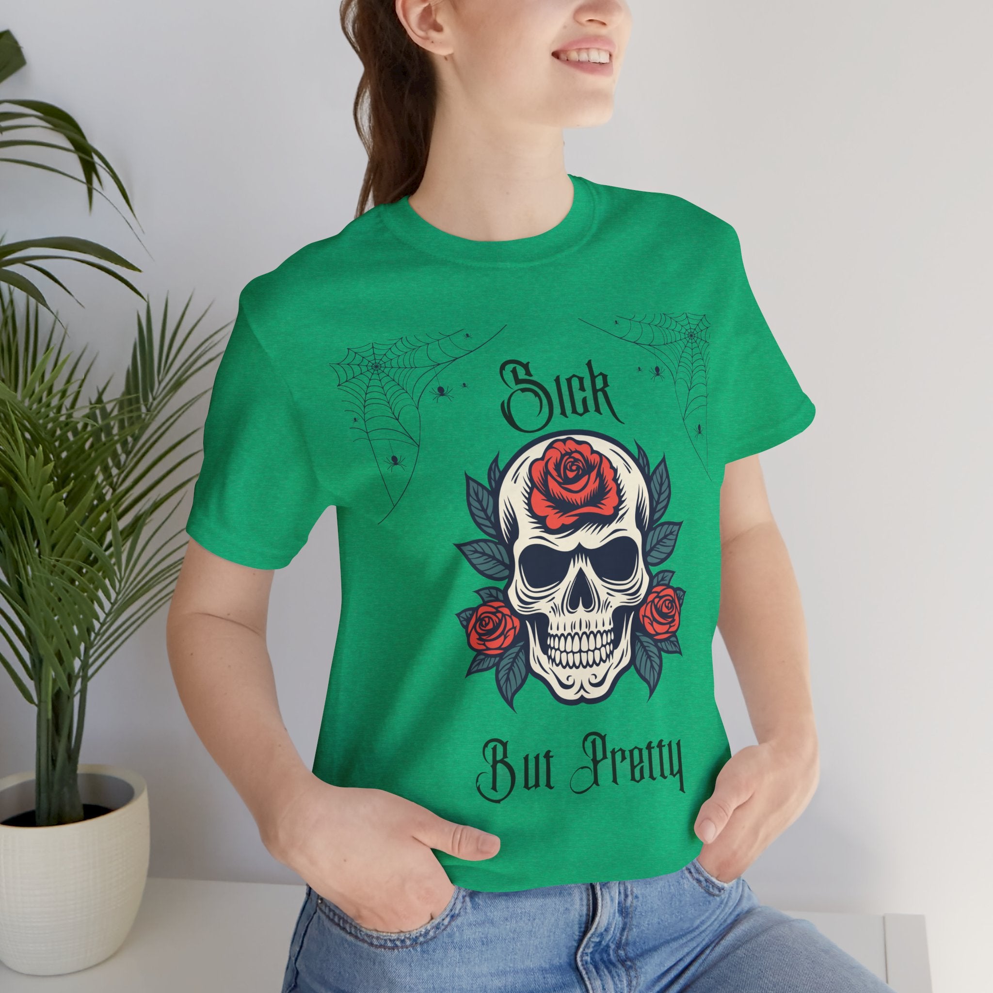 Black Skull and Spiderweb T-Shirt by Printify featuring a gothic design and the phrase "Sick but Pretty" on the front.
