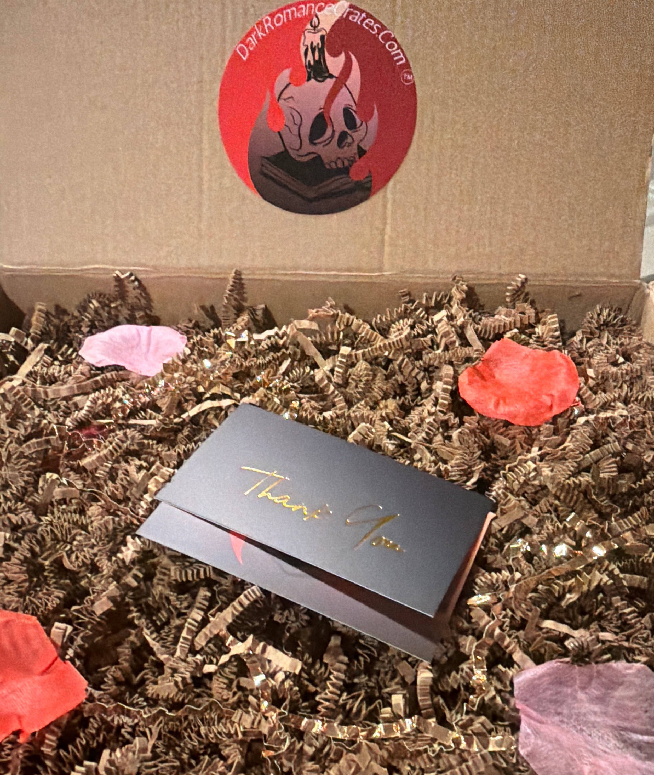 Dark Romance Crates Book Club box with dark romance novels and themed merchandise for book lovers and book parties.