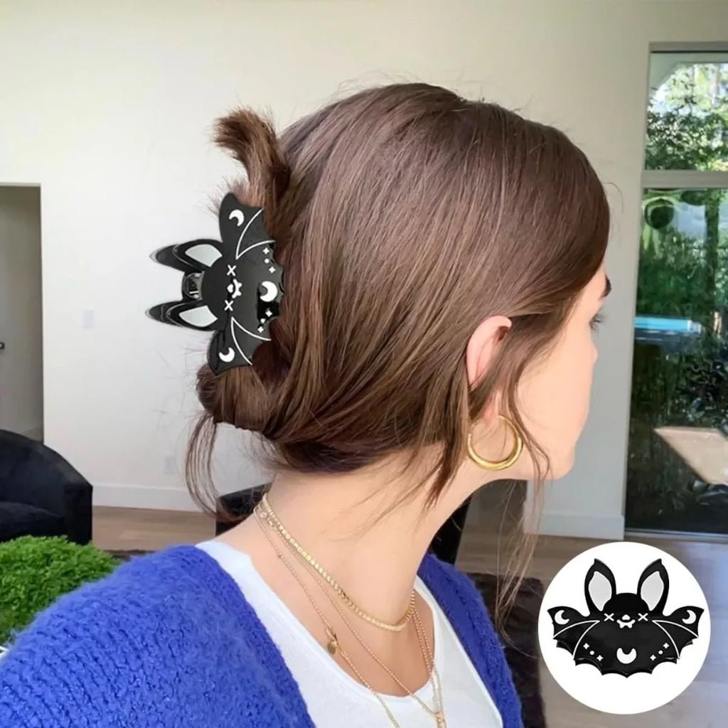 Black bat-shaped Halloween hair claws by Green Witch Creations, featuring spooky bat designs for festive hair accessories.