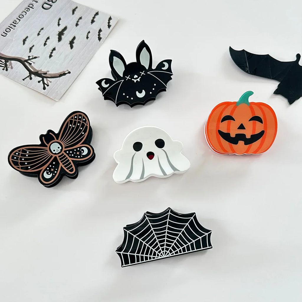 Green Witch Creations Halloween hair claws, spooky hair accessories with claw-shaped design for festive styling, shown in the image.