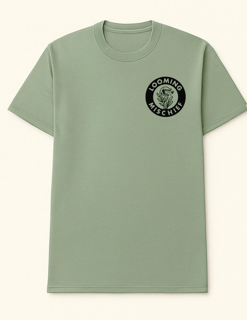 Looming Mischief Cultivating Chaos T-Shirt featuring a bold graphic design on a casual clothing piece.