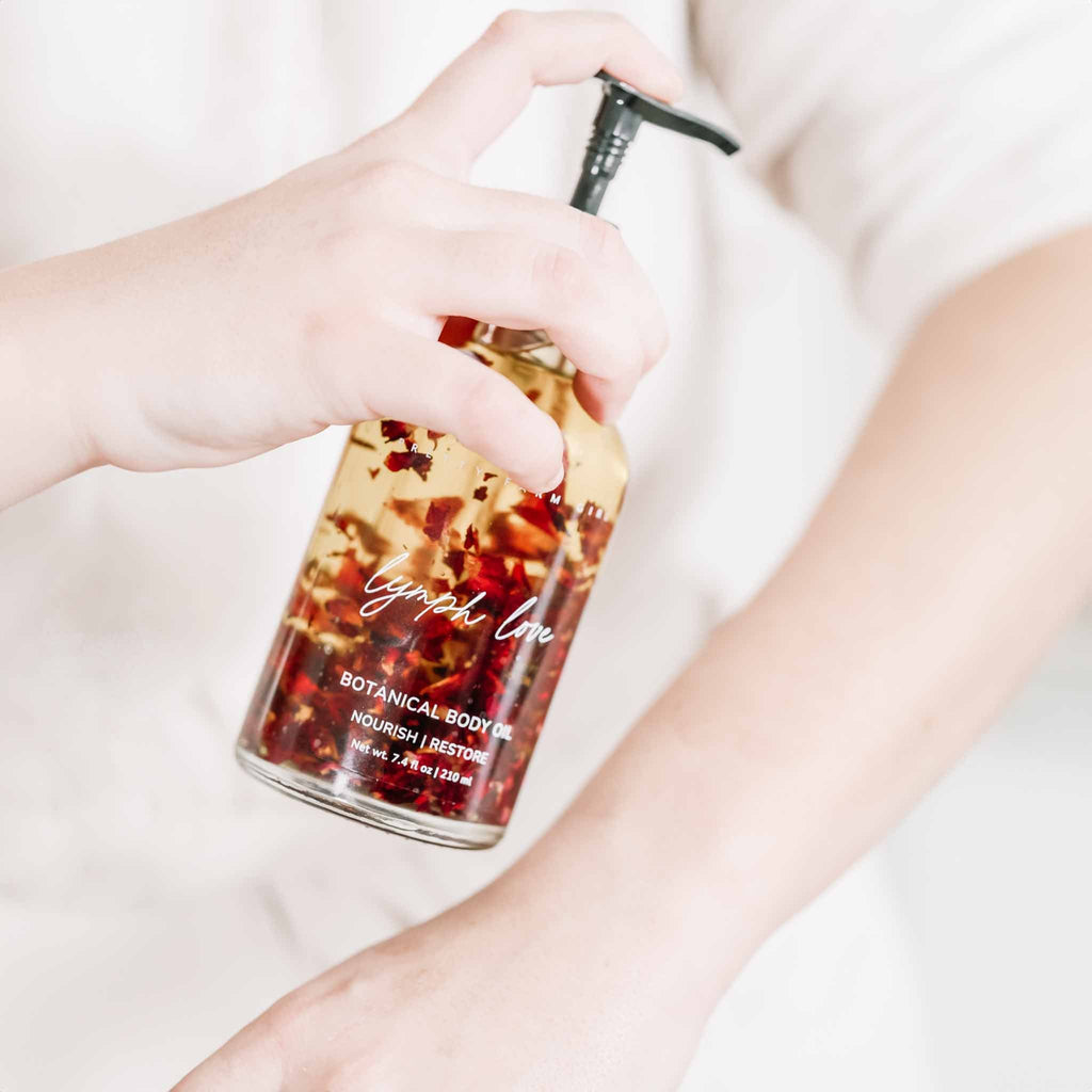 Pretty Farm Girl Lymph Love Natural Body Oil for lymphatic massages, featuring a sleek bottle with botanical ingredients.