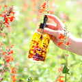 Natural body oil bottle labeled Lymph Love by Pretty Farm Girl, designed for lymphatic massages in health and beauty care.