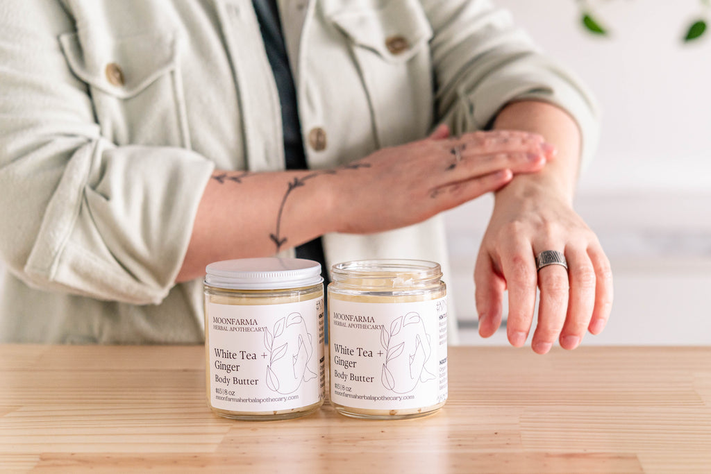 Creamy MoonFarma body butter jar with smooth texture, showcasing a luxurious moisturizer for soft, hydrated skin.