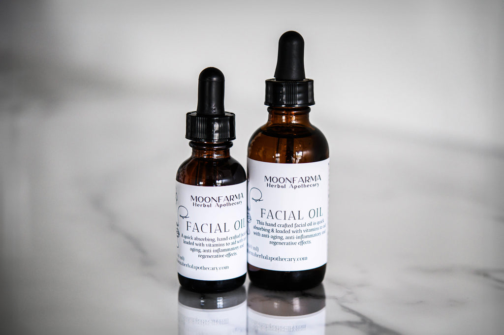 Dropper bottle of MoonFarma facial oil with natural ingredients, showcasing a sleek glass container and dropper for skincare.