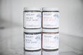 Creamy clay face mask by MoonFarma, showing a smooth, natural clay mask spread in a bowl ready for skincare use.