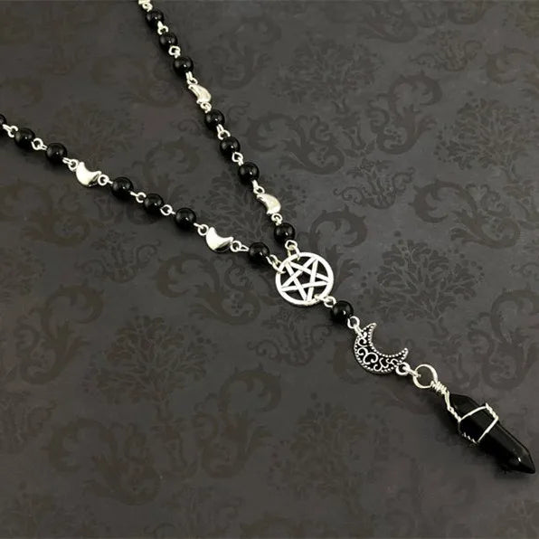 Black onyx bead necklace featuring a pentacle and moon pendant, crafted by Green Witch Creations.