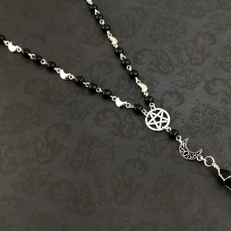 Onyx bead necklace featuring a pentacle and moon pendant, crafted by Green Witch Creations, ideal for spiritual or mystical jewelry.