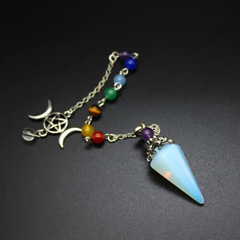 Triple Moon Pentacle Chakra Pendulum by Green Witch Creations showcasing a silver-toned pendant with moon and pentacle symbols.