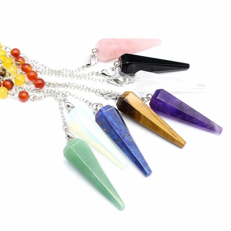 Green Witch Creations Triple Moon Pentacle Chakra Pendulum showing a brass pendant with moon and pentacle symbols.