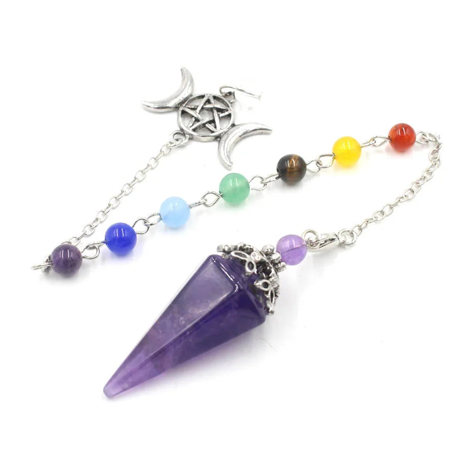 Green Witch Creations Triple Moon Pentacle Chakra Pendulum hanging from a chain with intricate moon and pentacle designs.