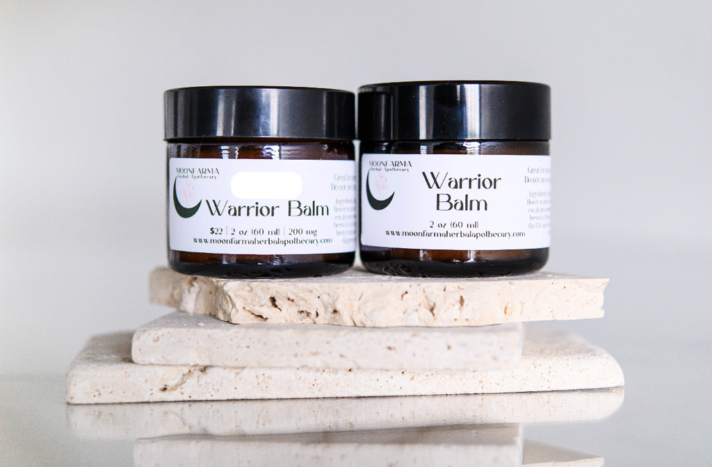 MoonFarma Warrior Balm for sore muscles, showing the balm jar and application in a natural setting, emphasizing relief and muscle recovery.