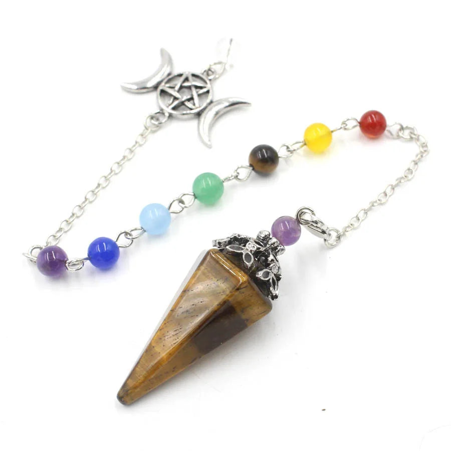 Triple Moon Pentacle chakra pendulum from Green Witch Creations, featuring a silver-tone design with moon and pentacle symbols.
