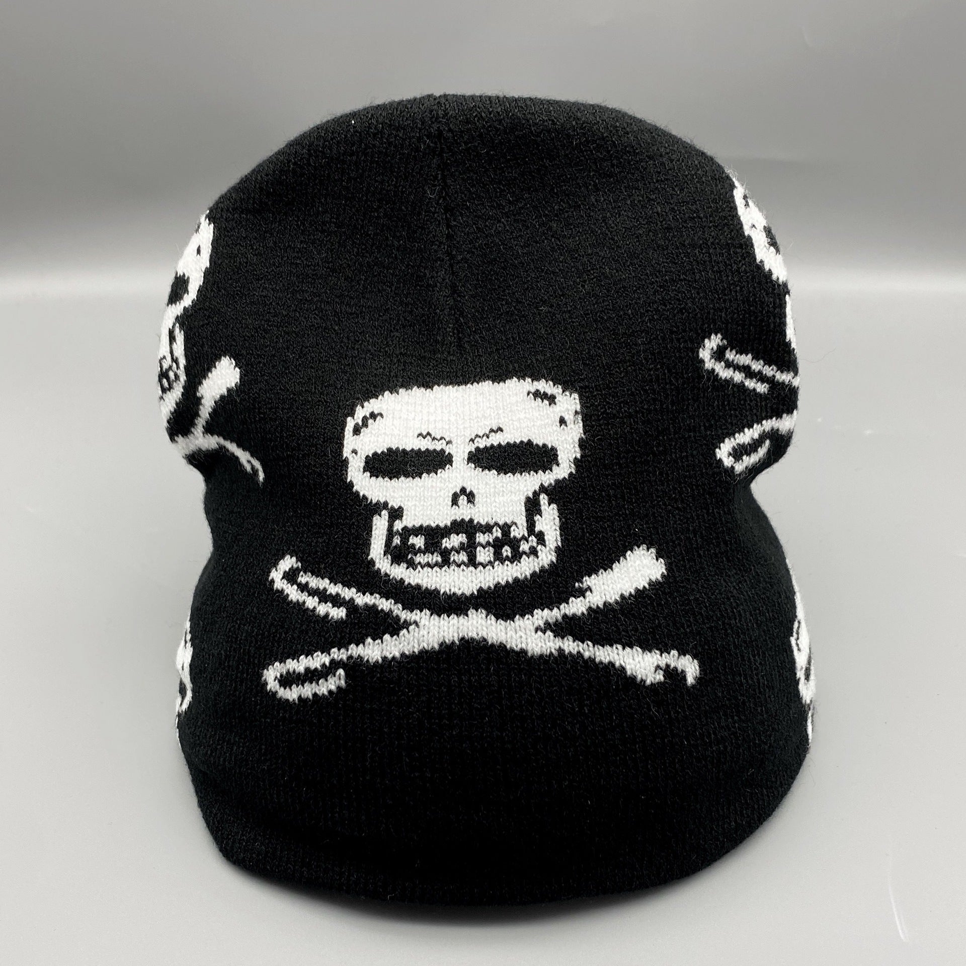 Men's black skull knitted hat by Blackthorn 31 featuring a bold skull pattern, perfect for stylish winter wear.