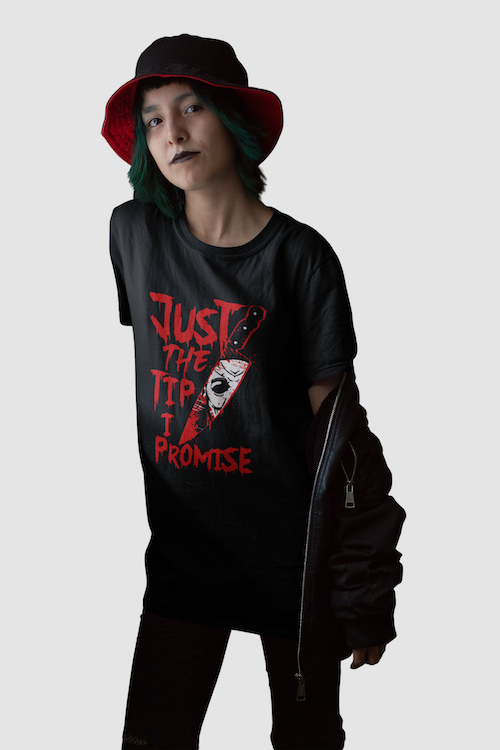 Blackthorn 31 Just the Tip Horror T-shirt featuring a goth girl graphic, worn inside a dark room setting.