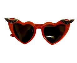 Black Nocturne Bats sunglasses by TORTURE COUTURE featuring bat-shaped frames and dark lenses.