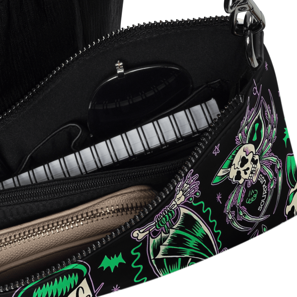 Black Psychobilly Blast crossbody bag from Goth Cloth Co. with bold graphic design and adjustable strap.