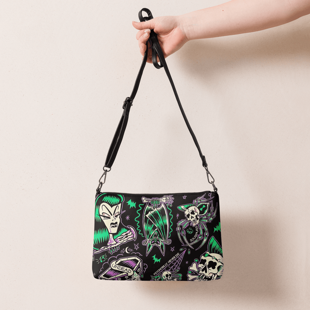 Psychobilly Blast Crossbody Bag by Goth Cloth Co. featuring vibrant graphic design and adjustable strap for casual style.