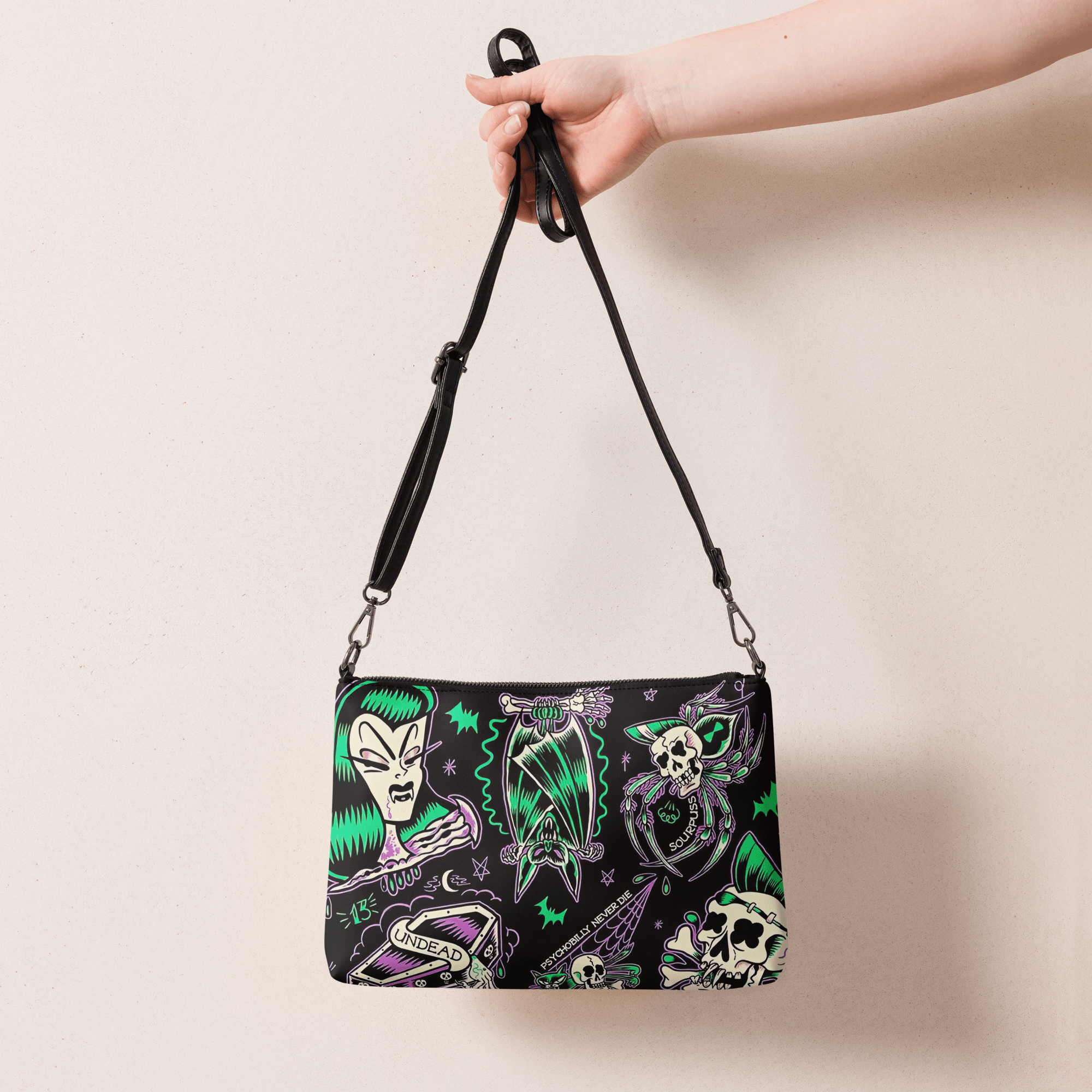 Psychobilly Blast Crossbody Bag by Goth Cloth Co. featuring vibrant graphic design and adjustable strap for casual style.