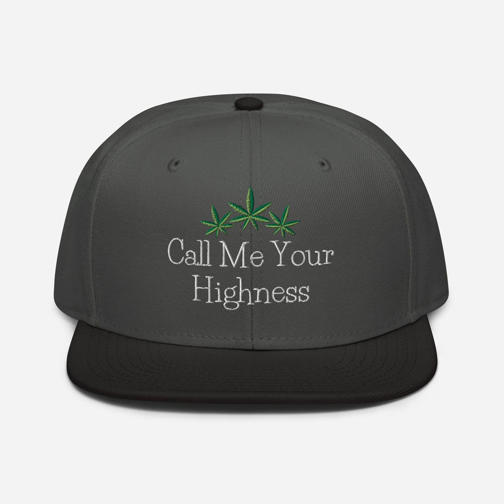 Black and charcoal gray Call Me Your Highness snapback hat by The Cannabis Community, front view showing adjustable snapback strap.