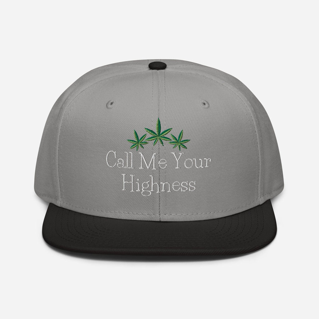 Black and gray Call Me Your Highness snapback hat by The Cannabis Community, featuring a structured front design.
