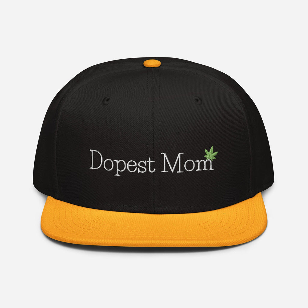 Gold and black Dopest Mom Cannabis Snapback Hat by The Cannabis Community, featuring a front logo design.