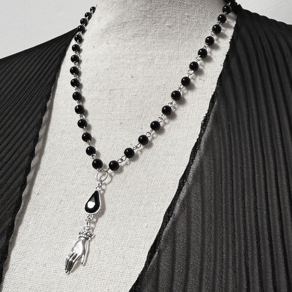 Witching Hour Baby Tears of Sorrow Necklace featuring a silver chain and pendant with a dark, gothic design.
